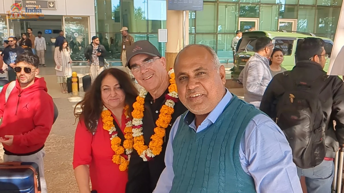 Traditional Marigold Welcome at Jaipur Airport International tourists receiving a traditional marigold flower garland welcome at Jaipur Airport in Rajasthan