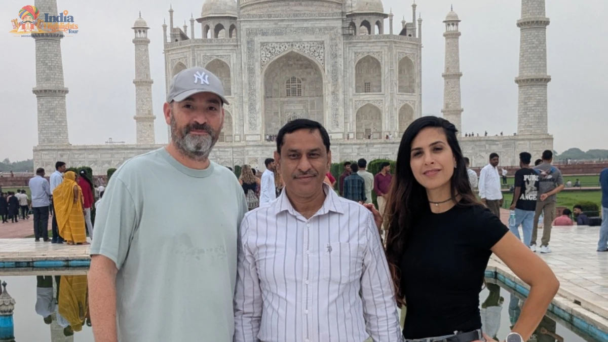 Memorable Visit to the Iconic Taj Mahal in Agra Guests accompanied by their private tour guide in front of the iconic white marble Taj Mahal in Agra